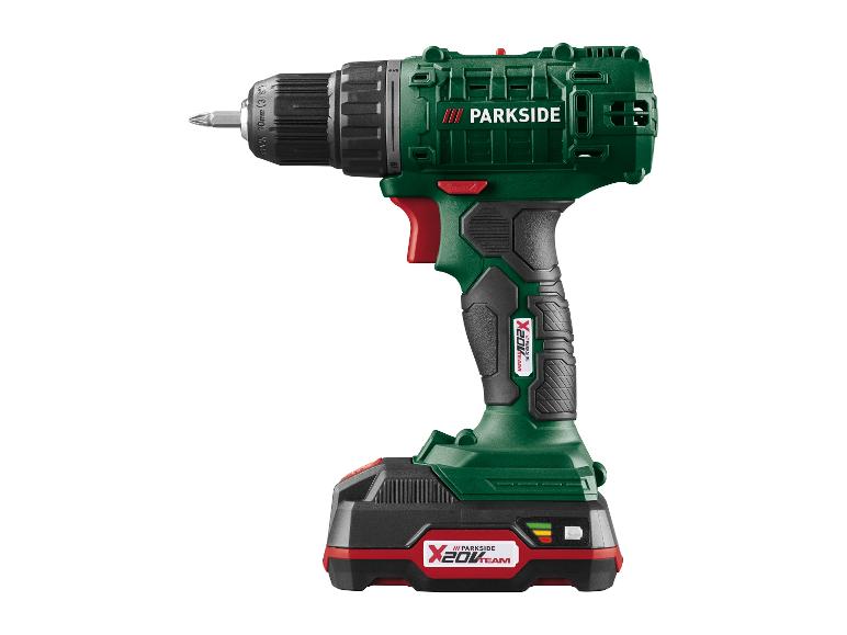 Accuboormachine met accu en bit, groen en zwart.