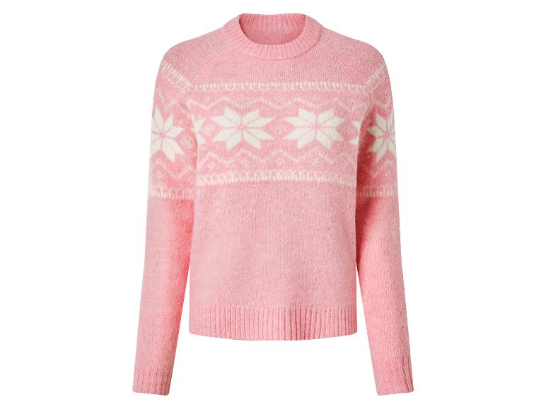 Roze gebreide trui met witte sneeuwvlokpatronen.
