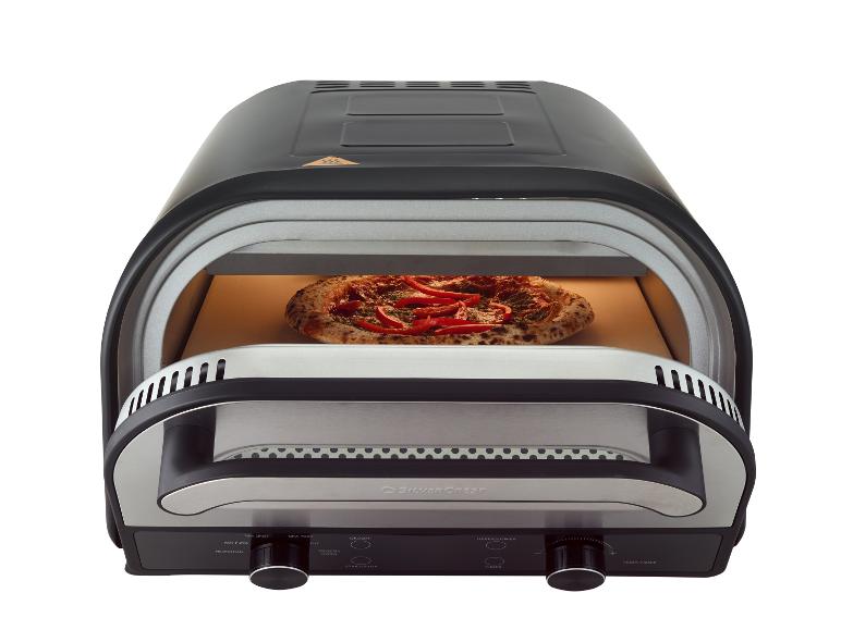Zwarte pizzaoven met pizza erin, bedieningselementen voor verschillende korsttypes en temperatuurinstellingen.