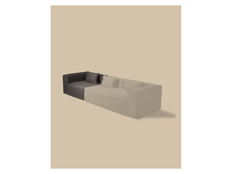 Modulaire L-vormige bank in donkergrijs en beige, met kussens.
