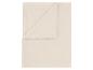 Beige fleece deken, gedeeltelijk gevouwen, toont zijn zachte textuur.
