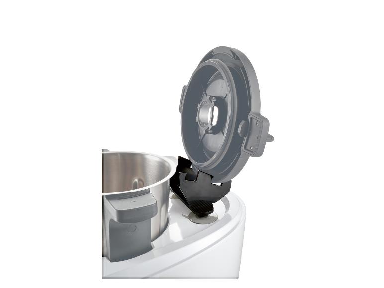 Deksel en roestvrijstalen kom van een keukenmachine.