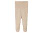 Beige baby leggings met voetjes.