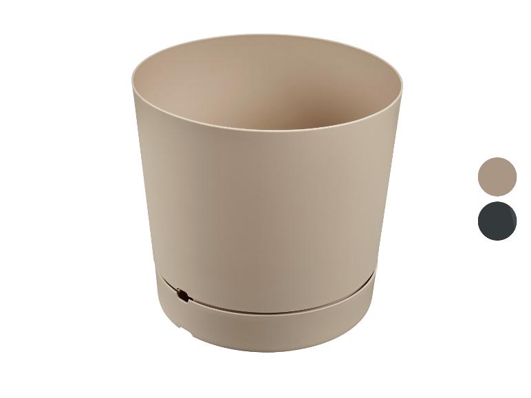 Beige plastic plantenpot met zelfbewateringssysteem en kleurenpalet