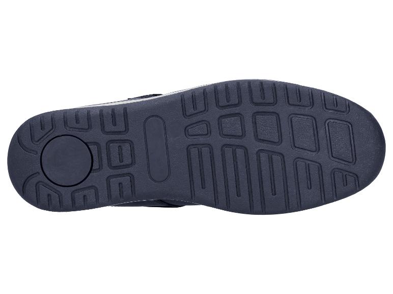 Donkere schoenzool met geometrisch profiel op een witte achtergrond.