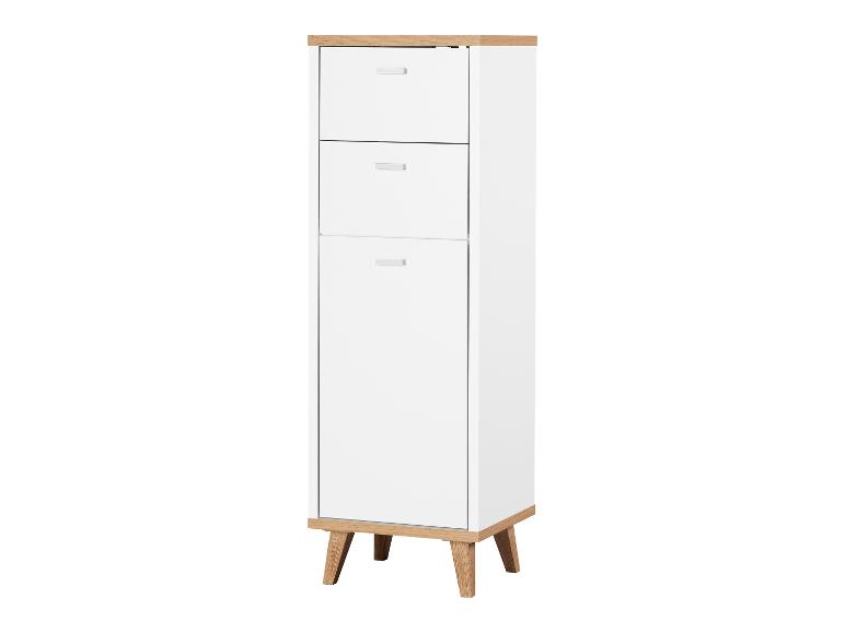 Witte kast met twee laden en een deur op houten poten.