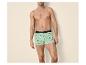 Lichtgroene herenboxershort met auto- en surfplankprint.