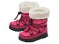 Roze kinderlaarzen met wit bont en zwarte veters.