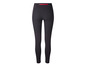 Zwarte leggings met rode rits achterop.
