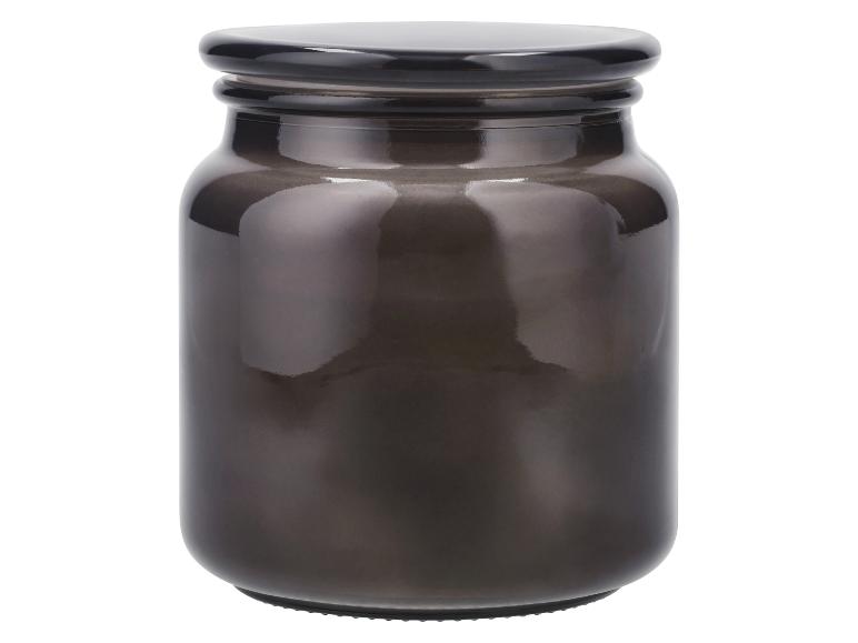 Donkere glazen pot met zwarte deksel