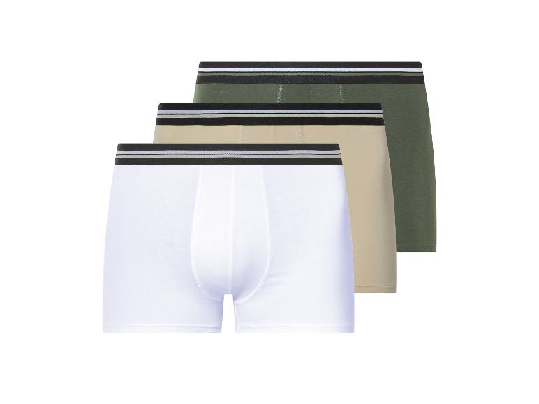 Drie paar heren boxershorts in wit, beige en groen.