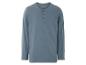 Een lichtblauw longsleeve shirt met knopen