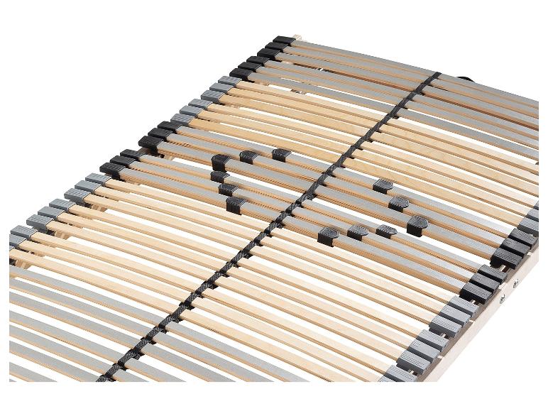 Een houten lattenbodem met zwarte en grijze bevestigingselementen.