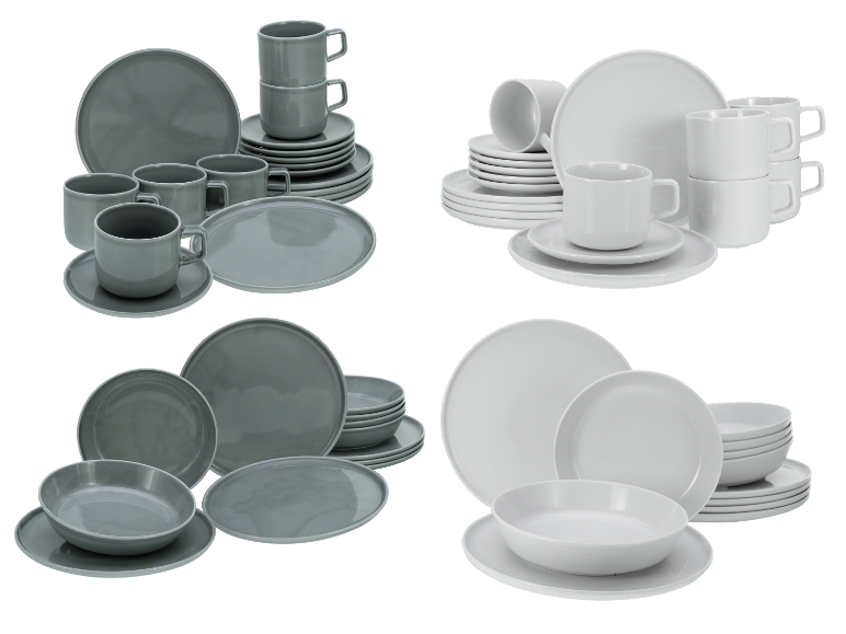 Servies in grijs en wit: borden, kommen en mokken.