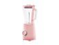 Roze blender met een glazen kan en een bedieningsknop op een witte achtergrond