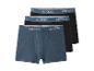 Drie herenboxershorts, één blauw en twee zwart, met esmara-merk op de tailleband.