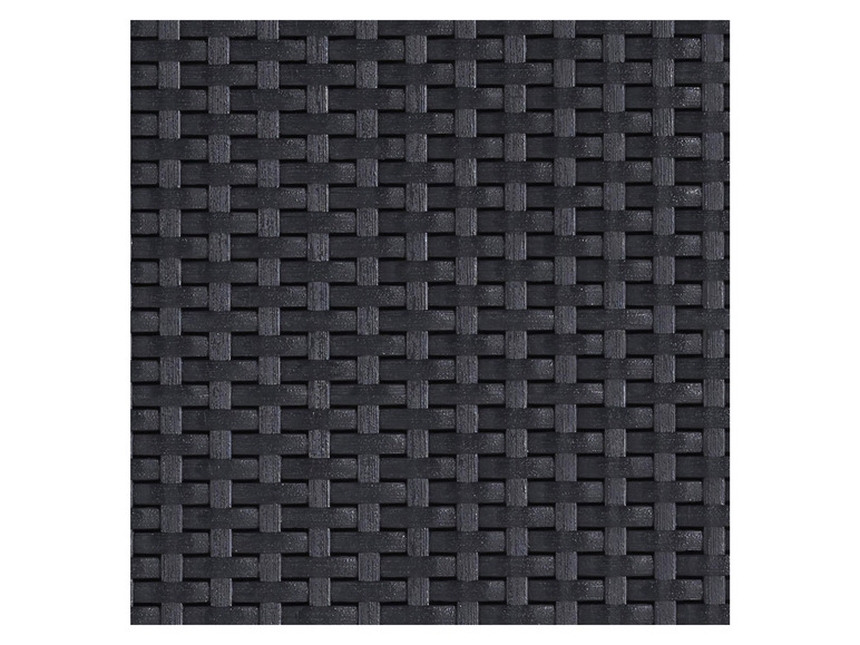 Een zwart geweven patroon, mogelijk voor een meubelstuk of decoratie.