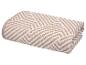 Gevouwen beige en wit patroon handdoek