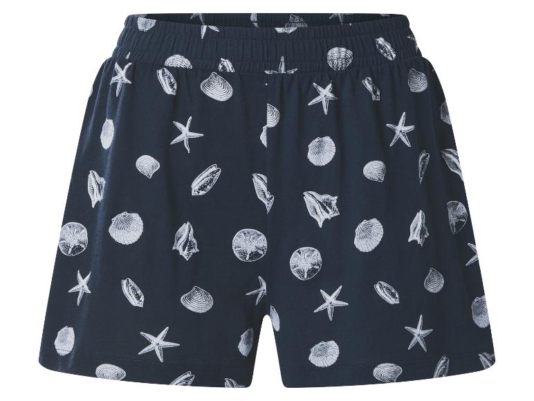 Donkerblauwe short met wit schelpen- en zeesterrenpatroon, elastische tailleband.
