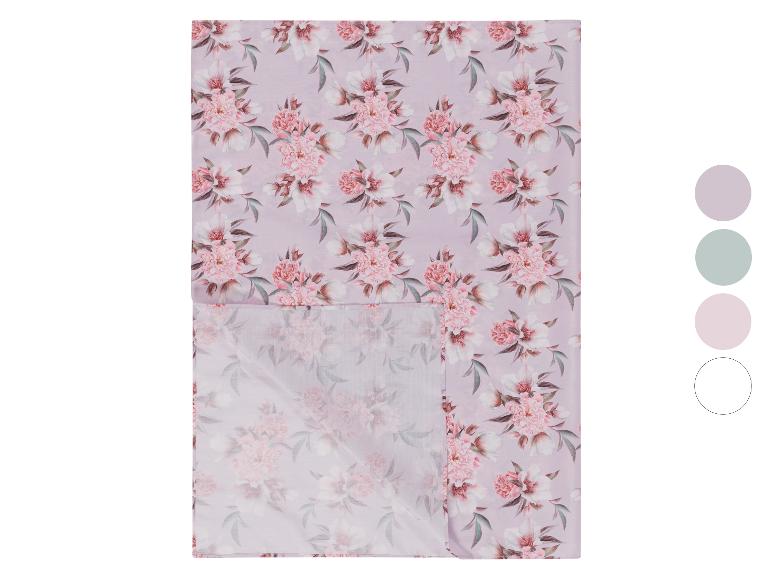 Dekentje met roze bloemenprint en kleurensamples.