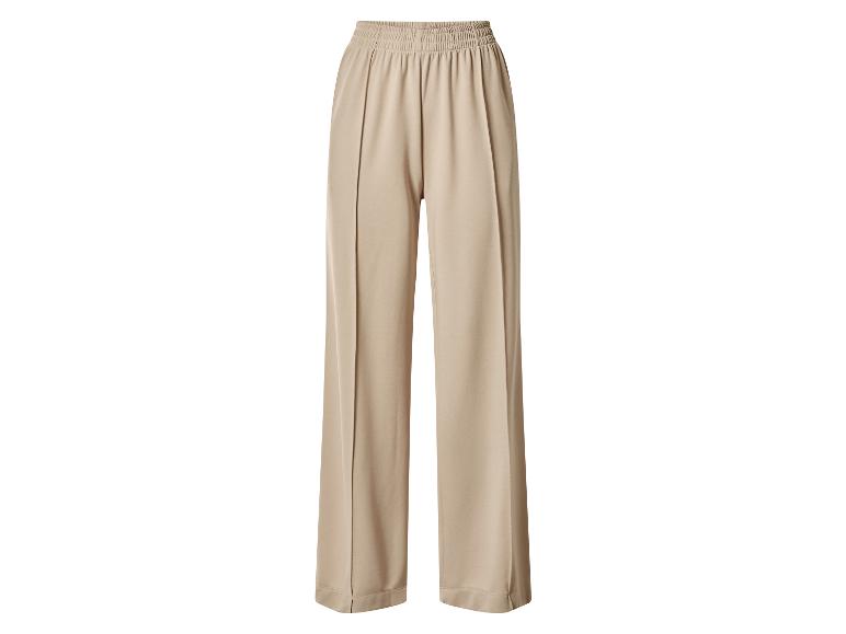 Beige wijde broek met elastische tailleband.