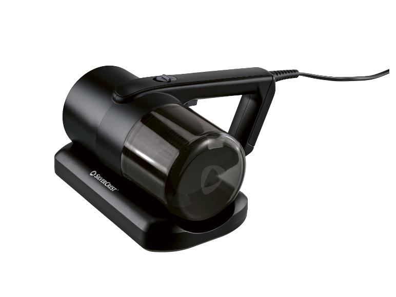 Zwarte kruimeldief met transparant stofreservoir, op een oplaadstation.