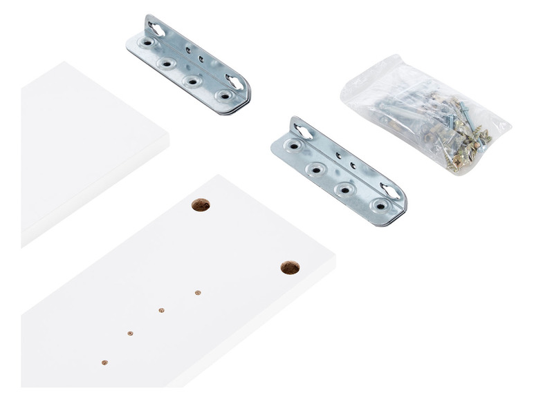 Witte planken, metalen beugels en schroeven voor het monteren van een plank.
