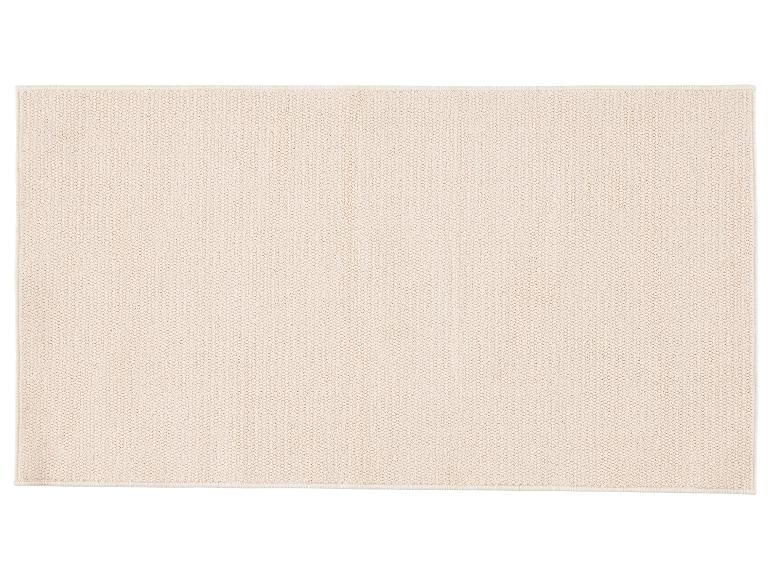 Lichtbeige rechthoekig vloerkleed met een dichte lussenstructuur.