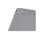 Grijze kussen- of matrashoek met stoftextuur
