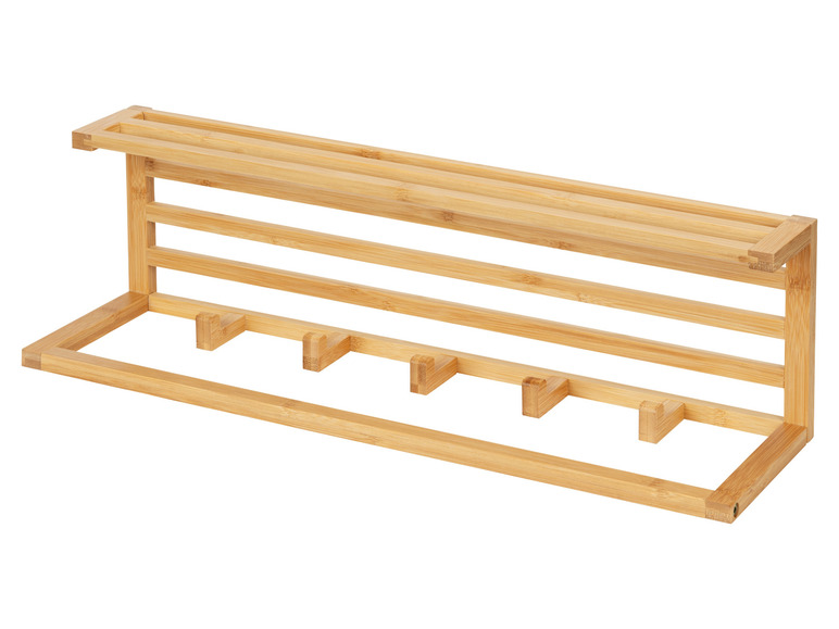 Een houten kapstok met vijf haken.