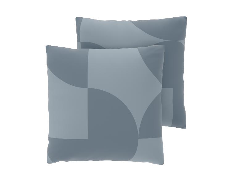 Twee grijze sierkussens met een geometrisch patroon van cirkels en vierkanten.