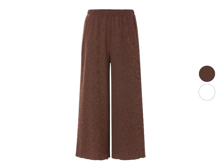 Bruine wijde broek: ruime en comfortabele pasvorm.