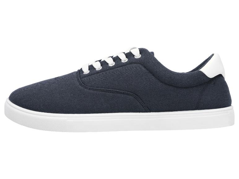 Donkerblauwe herensneakers met witte veters en zool.