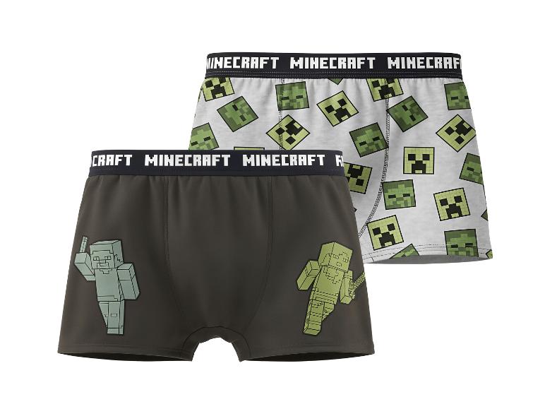 Twee kinderboxershorts met videogame-thema, één met Creeper-hoofden, de andere met personages.