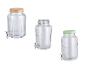 Drie glazen drankdispensers met kranen en diverse deksels.