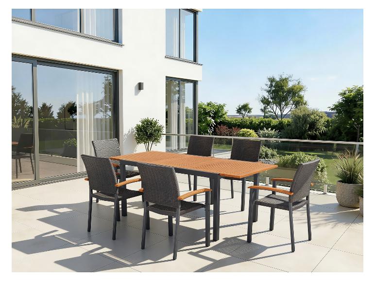 Tuinmeubelset: tafel met houten blad en zes stoelen op een terras.