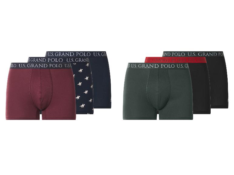 Zes U.S. Grand Polo boxershorts in diverse kleuren, waaronder bordeaux, marineblauw, groen en zwart.