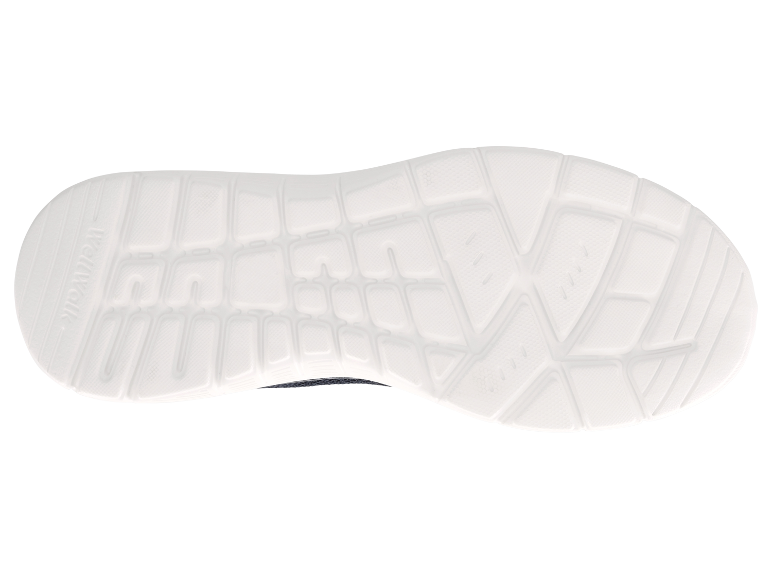 Zool van een witte Skechers schoen.