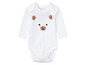 Witte baby-romper met beerprint.