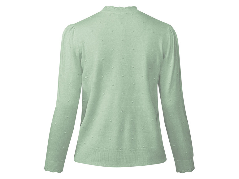 Groene gebreide trui met stippen.