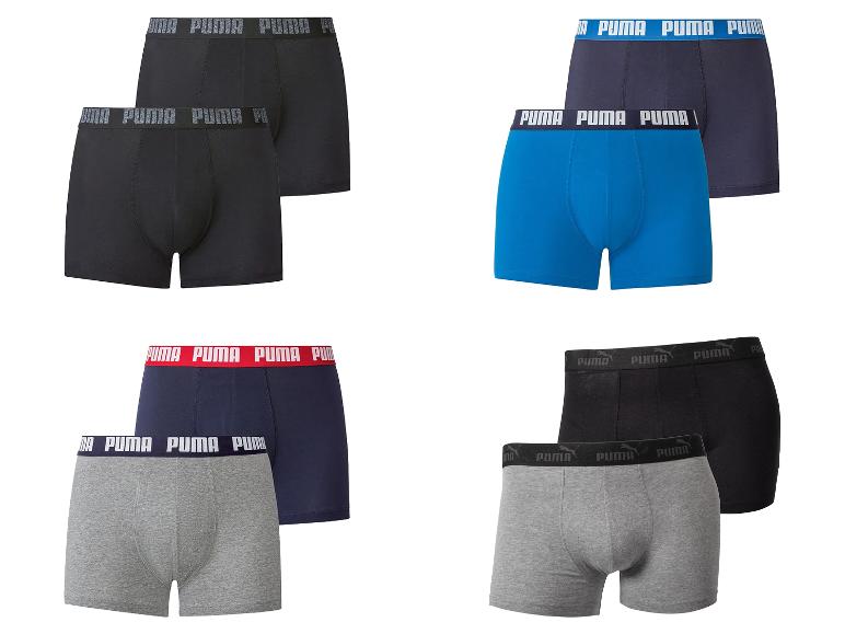 Set herenboxershorts in vier kleuren: zwart, blauw, marineblauw en grijs.