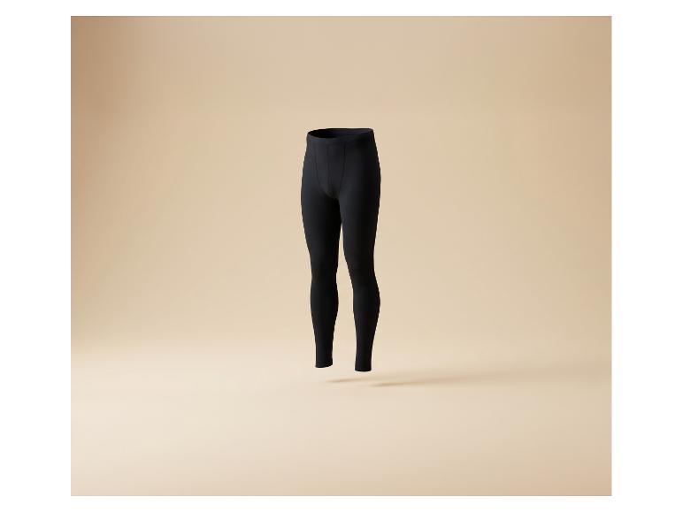 Zwarte herenlegging of onderbroek op een beige achtergrond.