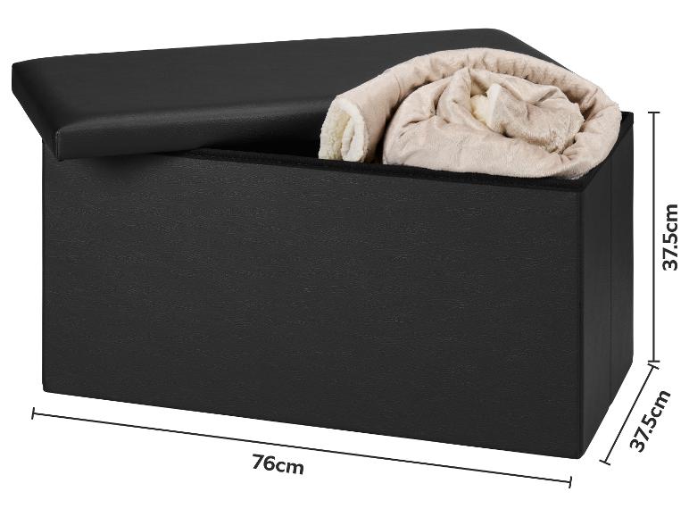 Zwarte opbergbank met open deksel en opgerolde deken, afmetingen 76x37,5x37,5cm.