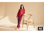 Meisje in rode pyjama met geruite broek en tekst 'Let's have breakfast'.