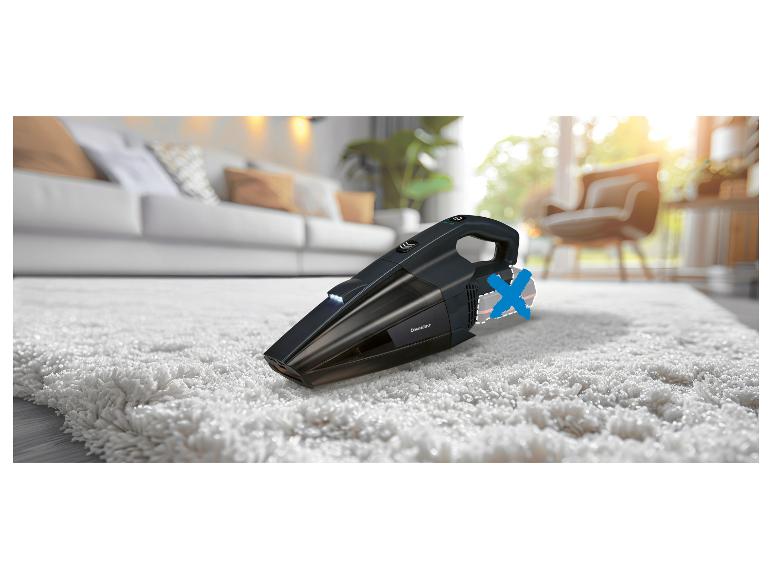 SilverCrest handstofzuiger op een tapijt.