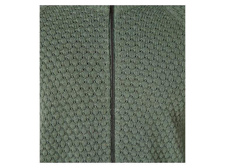 Een groene gebreide trui met rits.