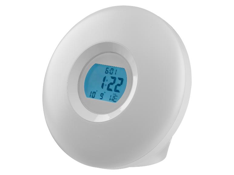 Een witte, ronde, moderne digitale wekker.