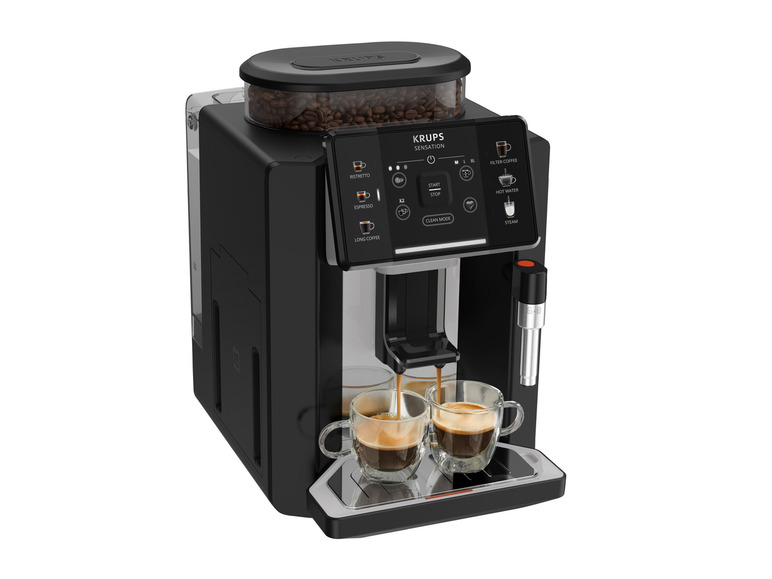 Een zwarte Krups Sensations koffiemachine die espresso in twee glazen schenkt.