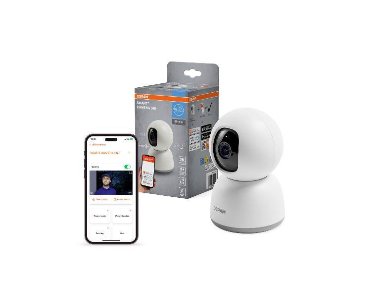 Slimme 360-graden camera en de verpakking ervan, met een telefoon met camera-app ernaast.