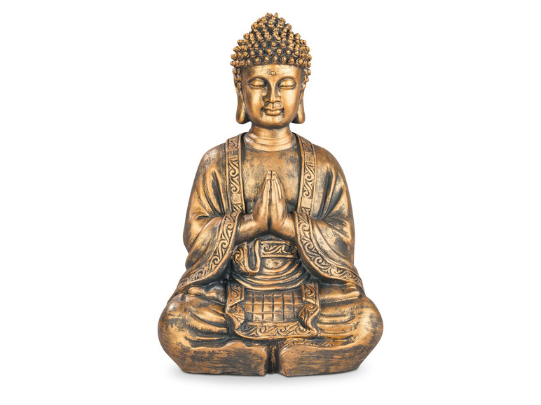 Een gouden Boeddhabeeldje in meditatiehouding.